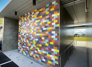 A wall with colorful tiles

AI-generated content may be incorrect.