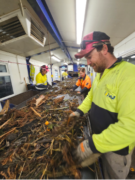 A group of people working in a factory
AI-generated content may be incorrect.