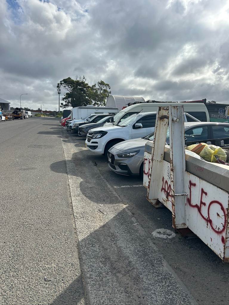 A group of cars parked in a parking lot

AI-generated content may be incorrect.