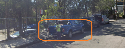 A person standing next to a blue truck

AI-generated content may be incorrect.