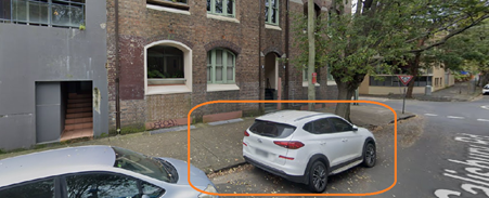 A car parked in front of a building

AI-generated content may be incorrect.