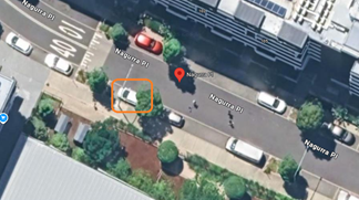 An aerial view of a street with cars and trees

AI-generated content may be incorrect.